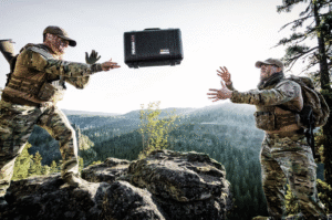 Pelican bag being tossed to teammate